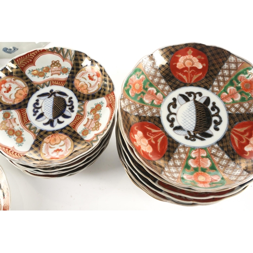 125 - A collection of Japanese Imari pattern plates, Taisho/Showa period, each painted with a central peac... 