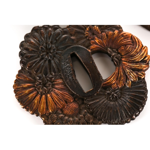 129 - A collection of five Japanese patinated and faux mixed metal Tsuba, decorated variously with stylize... 