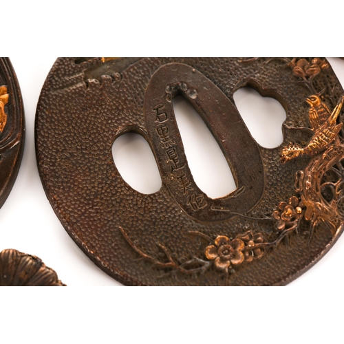 129 - A collection of five Japanese patinated and faux mixed metal Tsuba, decorated variously with stylize... 