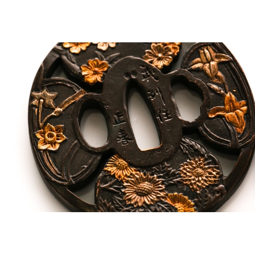 129 - A collection of five Japanese patinated and faux mixed metal Tsuba, decorated variously with stylize... 