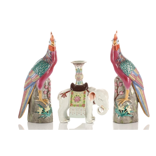 133 - A Pair of Chinese porcelain pheasants, late 20th century, each standing on a pierced rockwork mand f... 