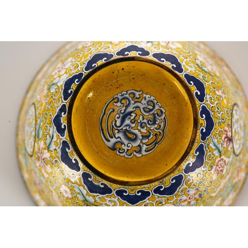 138 - A Chinese Canton enamel bowl with palmettes and scrolling 'Islimi' on a yellow ground, the interior ... 