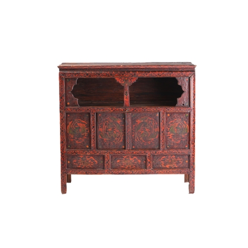 141 - A Tibetan Altar painted and lacquered altar cupboard. with an open frieze section and a pair of cupb... 