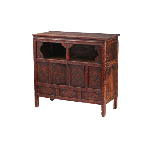 141 - A Tibetan Altar painted and lacquered altar cupboard. with an open frieze section and a pair of cupb... 