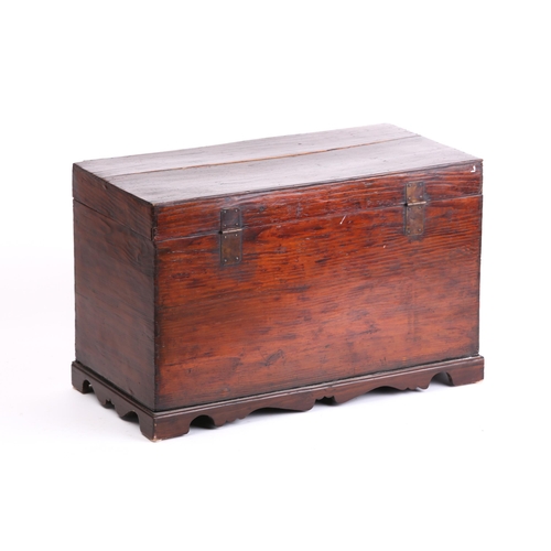 142 - A Korean elmwood blanket box 19th/20th century. With raised lacquer inscription and decorative brass... 