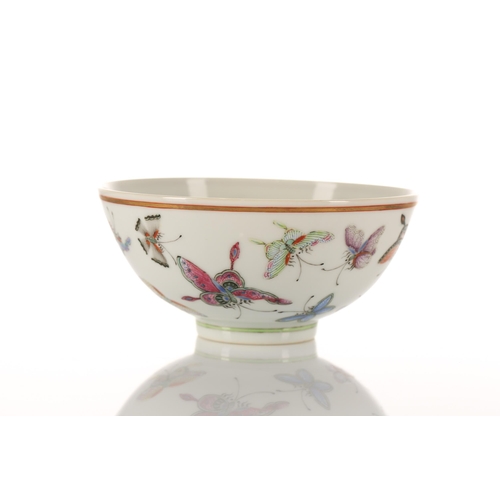 147 - A Chinese porcelain butterfly bowl, the interior painted with the eight trigrams bordering a Buddhis... 