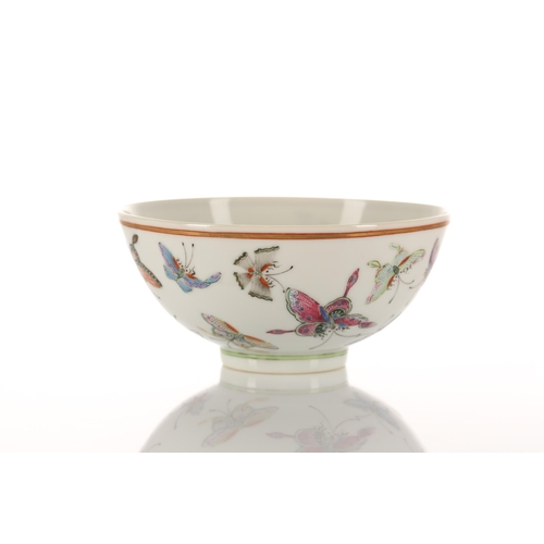 147 - A Chinese porcelain butterfly bowl, the interior painted with the eight trigrams bordering a Buddhis... 