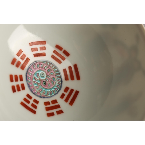 147 - A Chinese porcelain butterfly bowl, the interior painted with the eight trigrams bordering a Buddhis... 