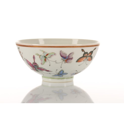 147 - A Chinese porcelain butterfly bowl, the interior painted with the eight trigrams bordering a Buddhis... 