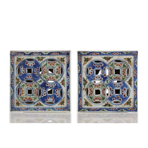 148 - A pair of Chinese porcelain Wucai stands, Republic period or later, of waisted square form, the top ... 