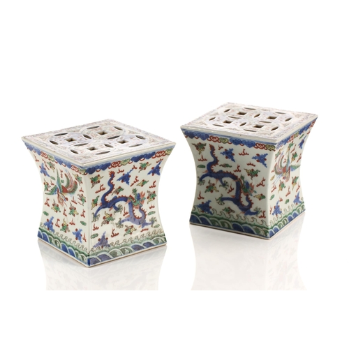 148 - A pair of Chinese porcelain Wucai stands, Republic period or later, of waisted square form, the top ... 