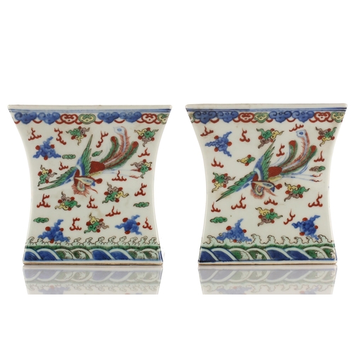 148 - A pair of Chinese porcelain Wucai stands, Republic period or later, of waisted square form, the top ... 