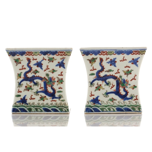 148 - A pair of Chinese porcelain Wucai stands, Republic period or later, of waisted square form, the top ... 