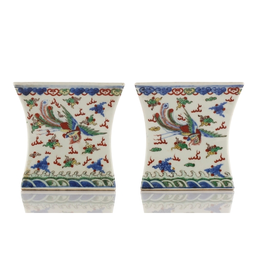 148 - A pair of Chinese porcelain Wucai stands, Republic period or later, of waisted square form, the top ... 