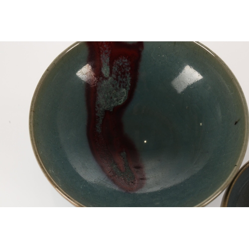 162 - A Chinese Jun ware bowl, the interior with a red splash against a pale blue ground, the glazing almo... 