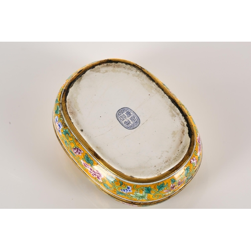 166 - A Chinese Canton enamel rounded oblong seal box. Decorated with golden pheasants amongst colourful s... 