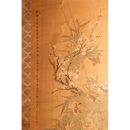 167 - A Chinese scroll painting on silk, 20th century, painted with birds amongst blossoming prunus and ba... 