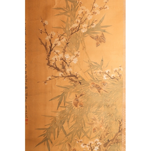 167 - A Chinese scroll painting on silk, 20th century, painted with birds amongst blossoming prunus and ba... 