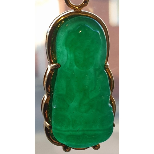 171 - An Eastern 18ct yellow gold and carved jadeite seated Buddha pendant. Marked 18K to the loop suspens... 