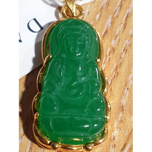 171 - An Eastern 18ct yellow gold and carved jadeite seated Buddha pendant. Marked 18K to the loop suspens... 