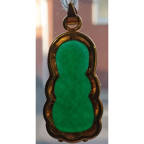 171 - An Eastern 18ct yellow gold and carved jadeite seated Buddha pendant. Marked 18K to the loop suspens... 