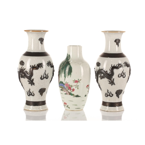 180 - Two pairs of Chinese porcelain vases and a single vase, Qing and later, comprising a famille rose pa... 