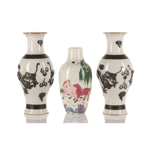 180 - Two pairs of Chinese porcelain vases and a single vase, Qing and later, comprising a famille rose pa... 