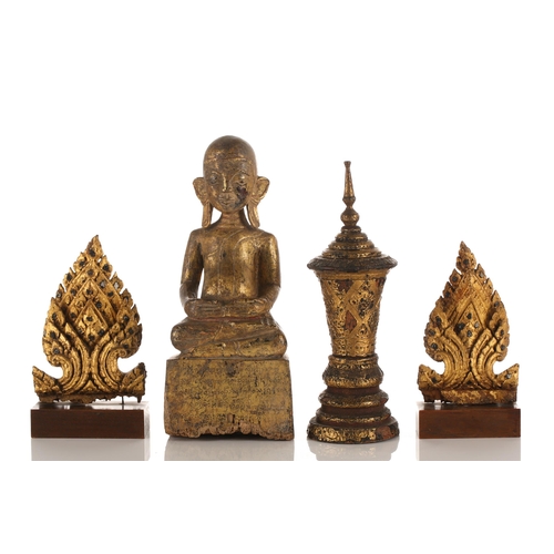 183 - A small collection of Thai carved and gilded wood Buddhas and acolytes, seated in varying mudras, th... 