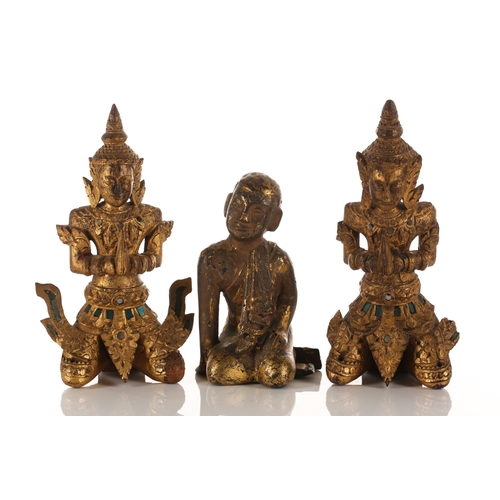 183 - A small collection of Thai carved and gilded wood Buddhas and acolytes, seated in varying mudras, th... 