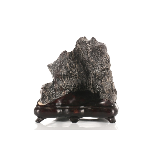 187 - For the Scholars desk, a small viewing stone, the black stone with white striations, on a purpose ma... 