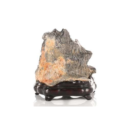 187 - For the Scholars desk, a small viewing stone, the black stone with white striations, on a purpose ma... 