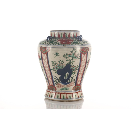 189 - A Chinese Transitional Wucai porcelain vase, 17th century, the shoulder with applied and pierced lug... 