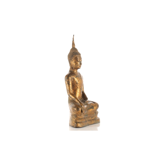 195 - A Thai gilt bronze figure of Buddha, 19th/20th century, seated in Bhumisparsha Mudra, with flaming u... 