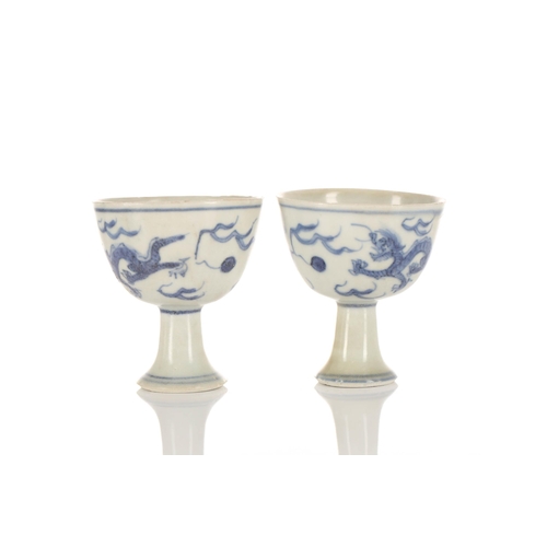 201 - A pair of Chinese blue & white stem cups, Ming dynasty, circa 1640, Hatcher cargo, each painted with... 