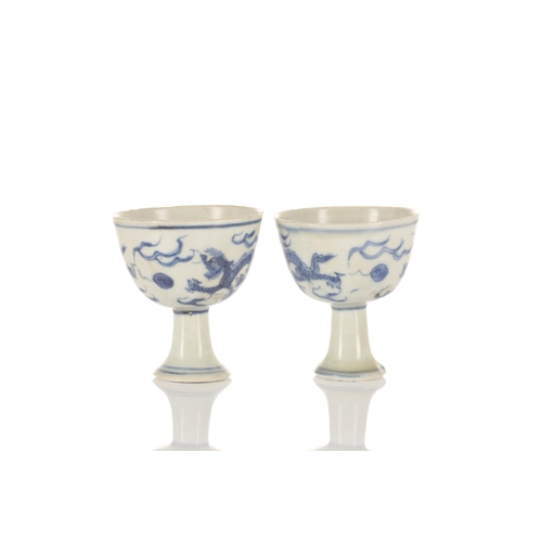 201 - A pair of Chinese blue & white stem cups, Ming dynasty, circa 1640, Hatcher cargo, each painted with... 