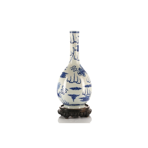 211 - A Chinese blue & white club shape vase, Qing, 19th century, the rim painted with a band of ruyi, the... 