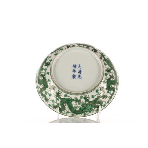 215 - A Chinese famille verte dragon saucer dish, Guangxu mark and possibly of the period, the central fac... 