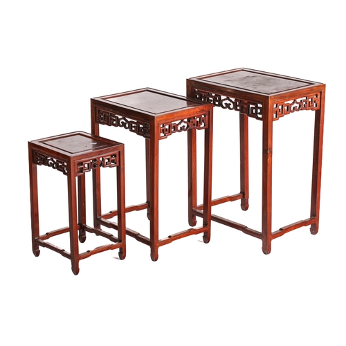 217 - A set of three Chinese hongmu and burr wood inter-sliding tables from a quartetto, 20th century. Wit... 