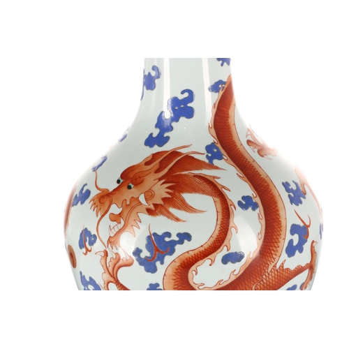 222 - A Chinese porcelain Tianqiuping shape vase, Republic Period, painted with two iron red dragons chasi... 