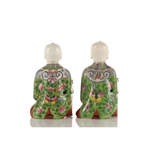 225 - A near pair of Chinese porcelain 'Laughing Boy' figures, Qing, probably Daoguang period, 19th centur... 