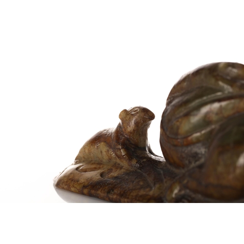 226 - A humorous Chinese carved jade figure of a rat, modelled with a large sack over its shoulder, a smal... 