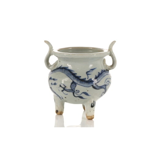 234 - A Chinese porcelain tripod censer, in the Ming style, painted with a dragon amongst fiery clouds, wi... 