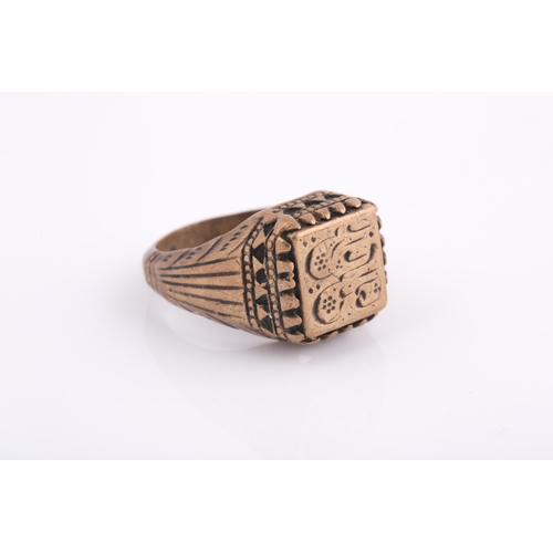 250 - A base metal Indo Persian gentleman's ring, engraved with calligraphic characters