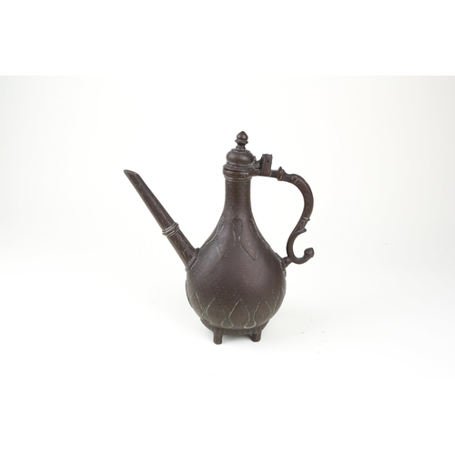 251 - An Indian Mughal brass ewer (Aftaba), 18th century or later, with hinged domed finial with pointed k... 