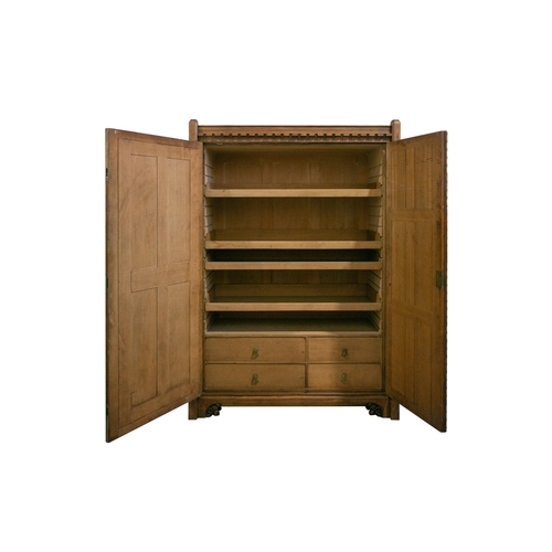 298 - A mid-19th century oak linen press by Gillows, based on designs by A.W.N. Pugin for the New Palace o... 