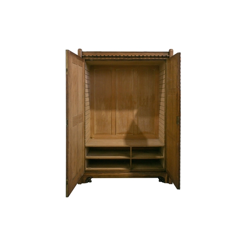 298 - A mid-19th century oak linen press by Gillows, based on designs by A.W.N. Pugin for the New Palace o... 