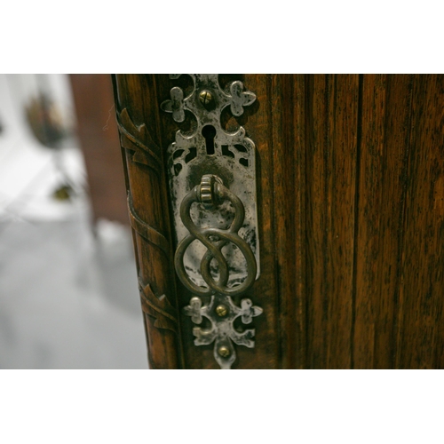 298 - A mid-19th century oak linen press by Gillows, based on designs by A.W.N. Pugin for the New Palace o... 