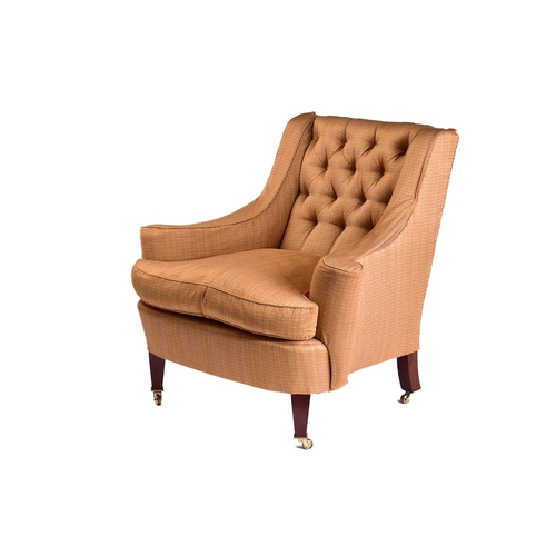 299 - A Howard Ltd upholstered armchair. 21st century, with shaped out swept arms and low, deep buttoned b... 