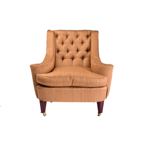 299 - A Howard Ltd upholstered armchair. 21st century, with shaped out swept arms and low, deep buttoned b... 