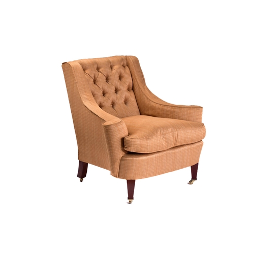 299 - A Howard Ltd upholstered armchair. 21st century, with shaped out swept arms and low, deep buttoned b... 